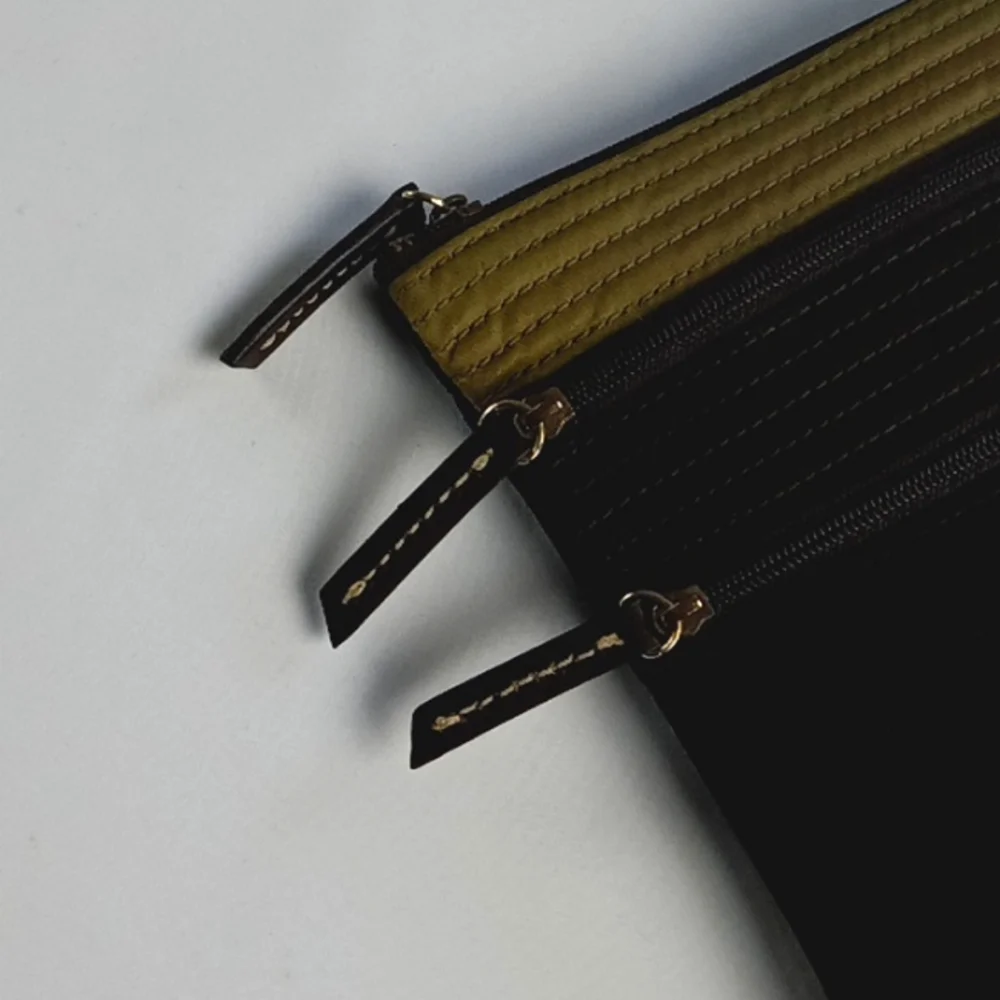 Dooney & Bourke Black and Olive Green Wristlet Clutch